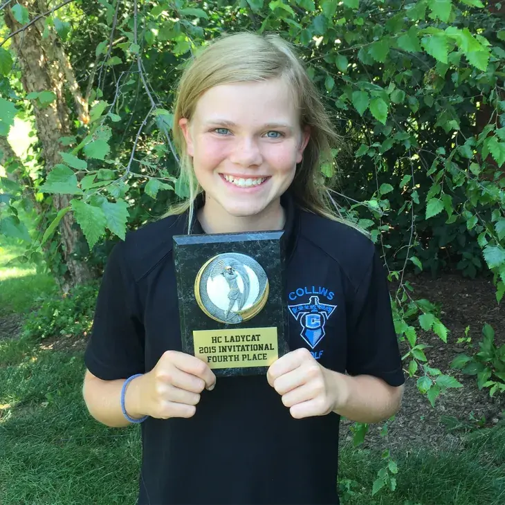 A young Rylee Suttor with a junior tournament medal